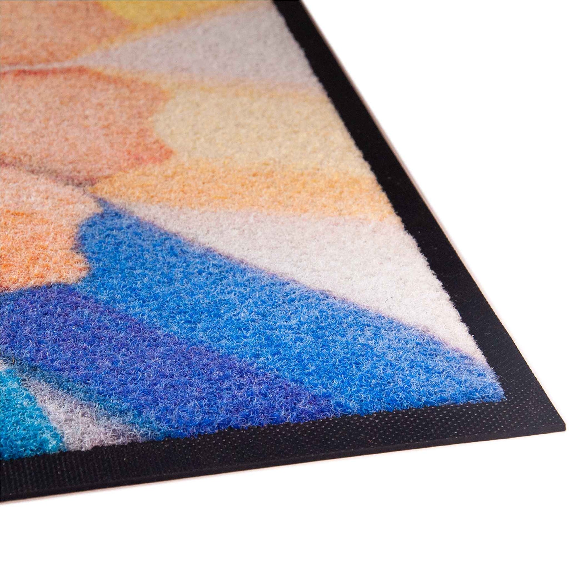Détail de finition d'un tapis grattant personnalisé avec logo, offrant une excellente qualité d'impression et une grande résistance à l'usure.