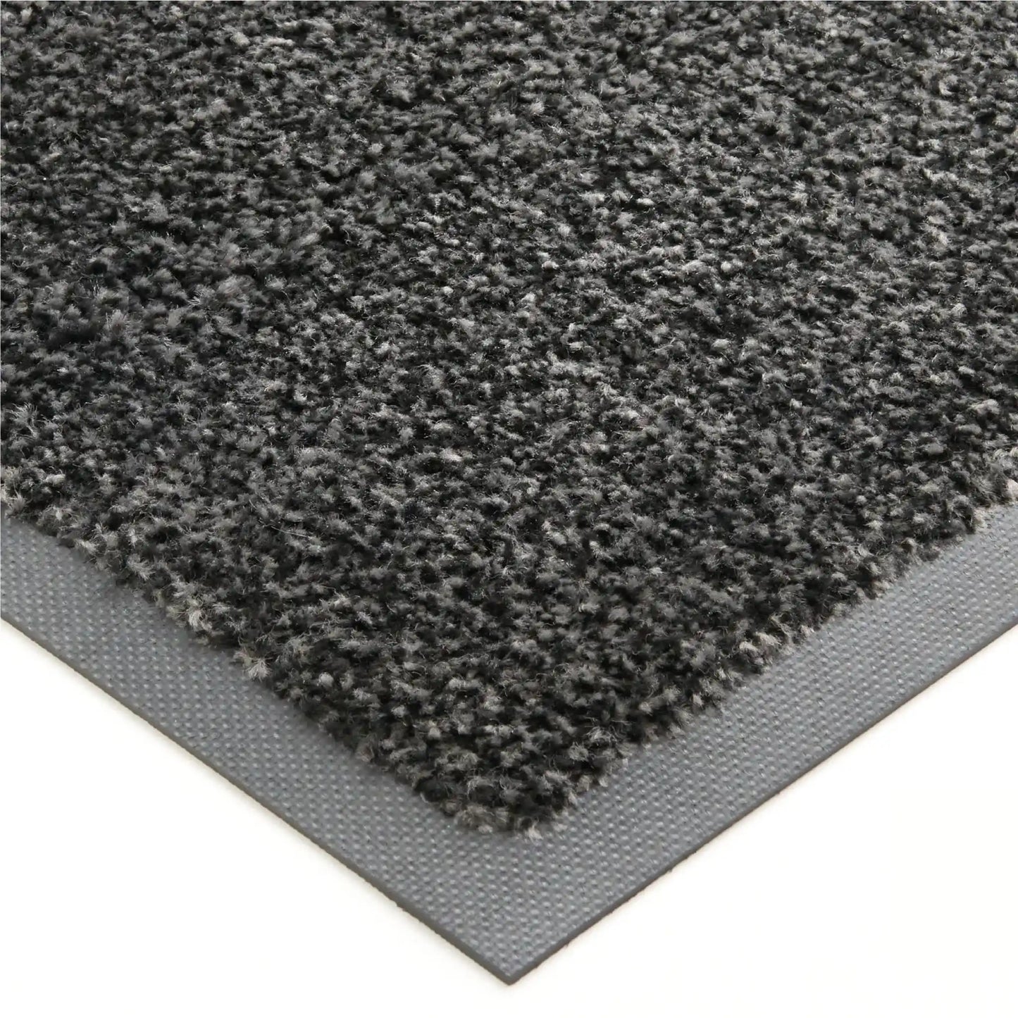 Gros plan sur la texture absorbante et la bordure antidérapante d’un tapis d’entrée professionnel écologique.
