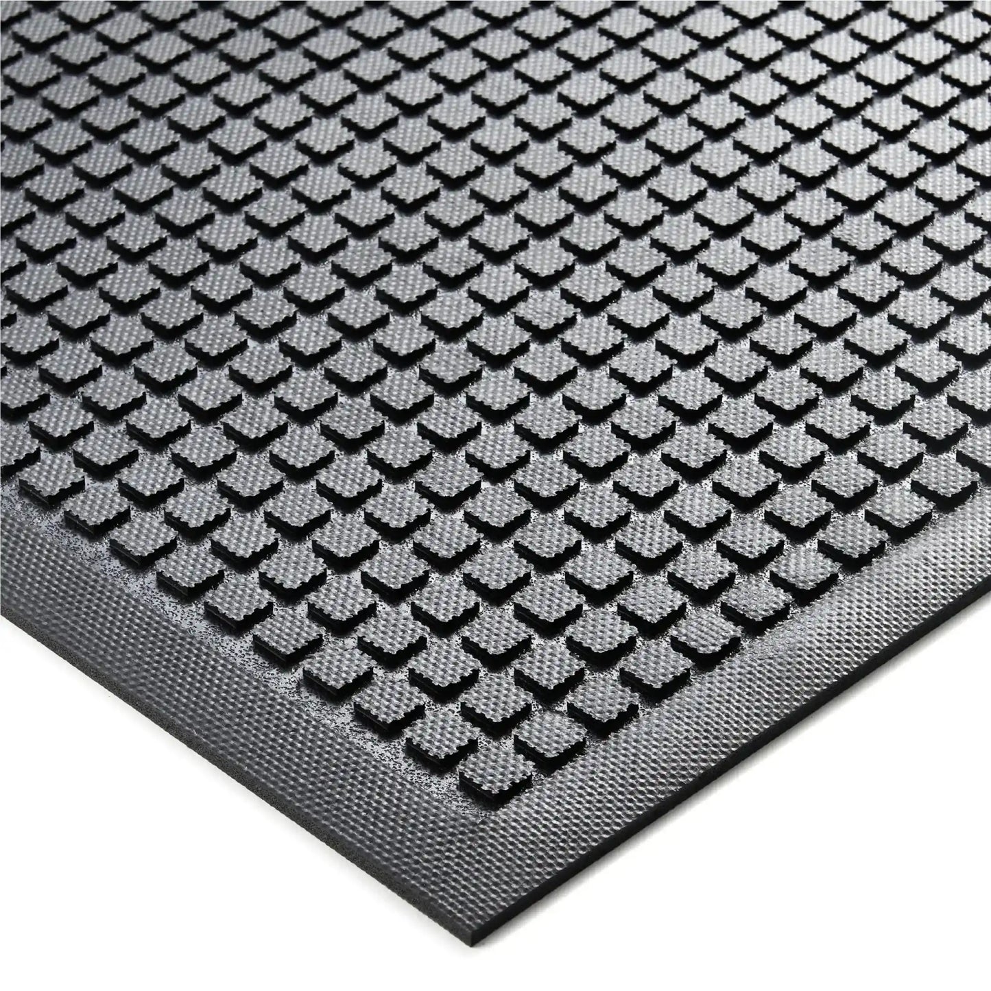 Détail de la surface antidérapante d’un tapis anti-fatigue professionnel industriel conçu pour les environnements exigeants.