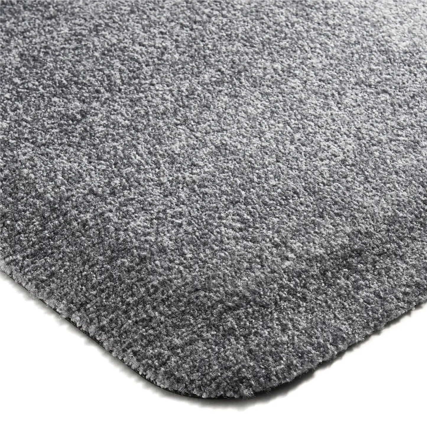 Détail de la surface textile confortable d’un tapis anti-fatigue professionnel intérieur avec coins arrondis.