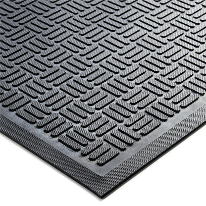 Détail du motif grattant en caoutchouc d’un tapis d’entrée professionnel conçu pour éliminer la saleté des chaussures.